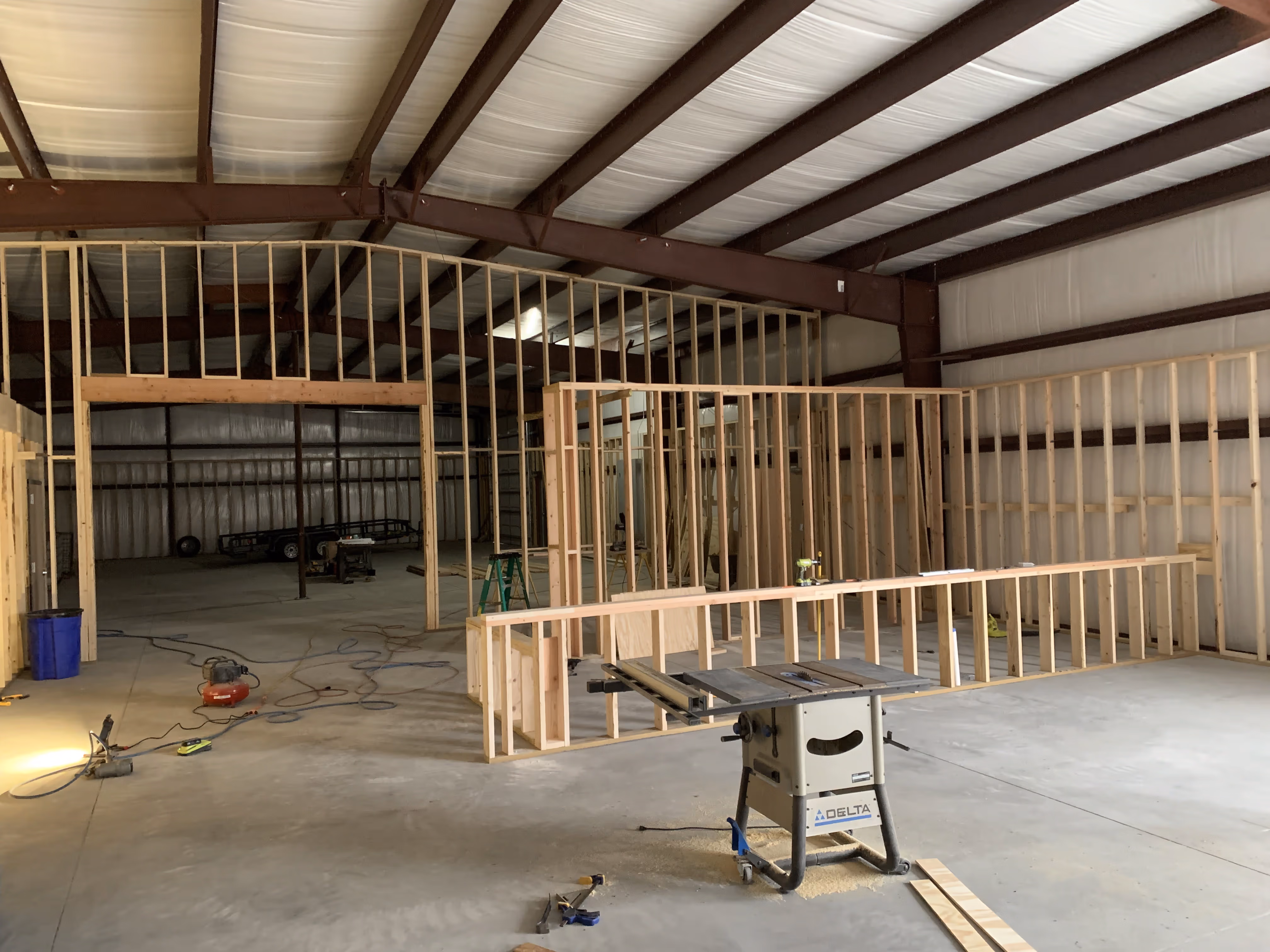 Wooden frames being erected as the new White Crow Crow Cider taproom building is constructed.