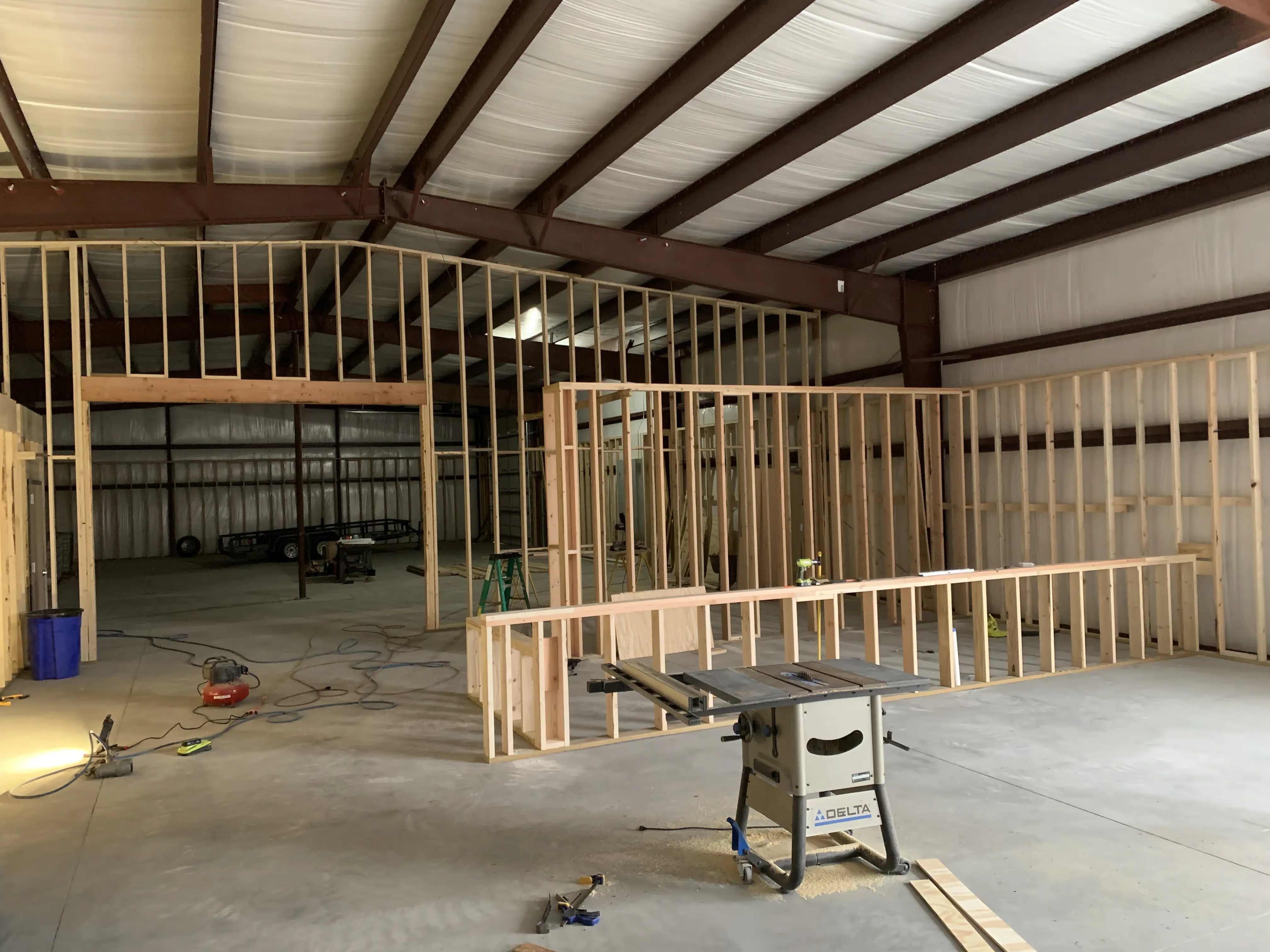 Wooden frames being erected as the new White Crow Crow Cider taproom building is constructed.